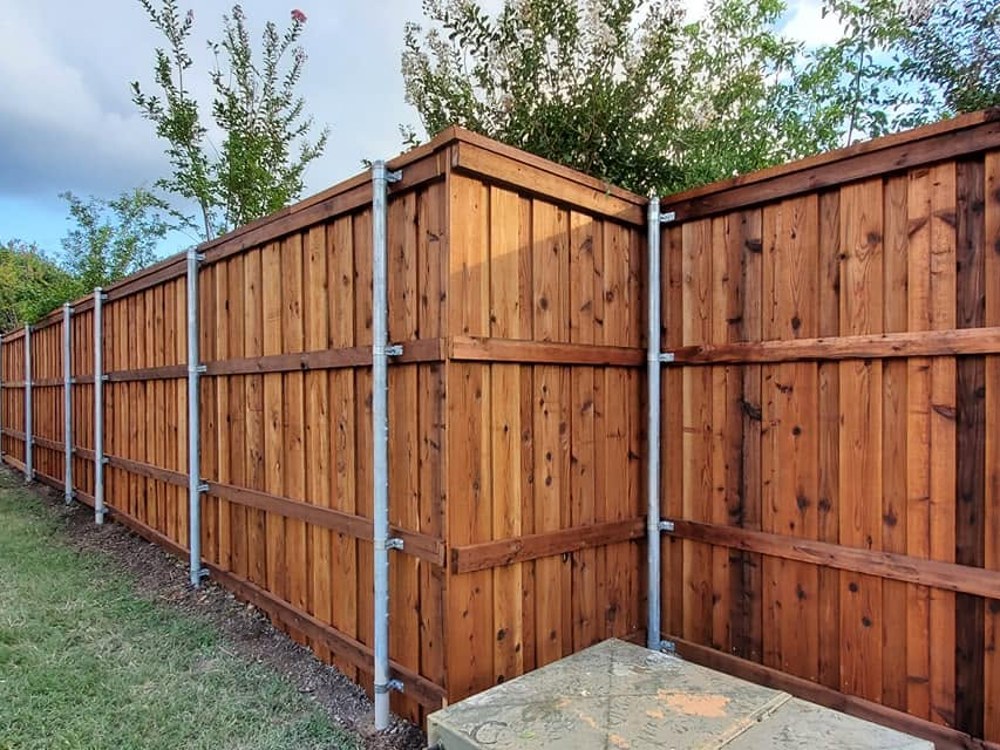 Cedar privacy fence corner with galvanized steel posts
