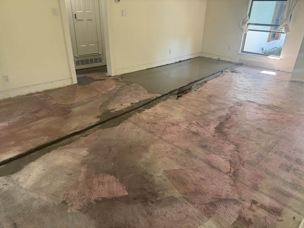 Self-leveling concrete poured over subfloor