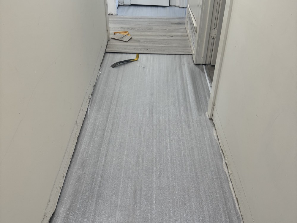 Moisture barrier underlayment installed in hallway