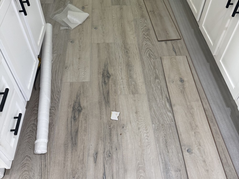 Luxury vinyl plank installation in kitchen