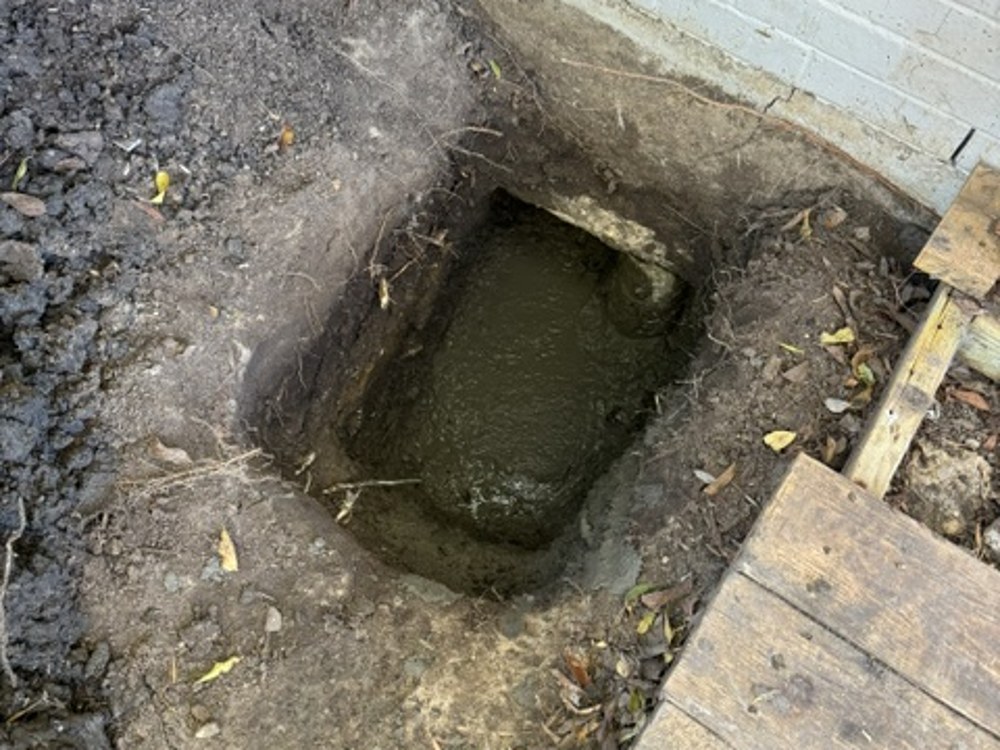 New concrete poured at foundation pier