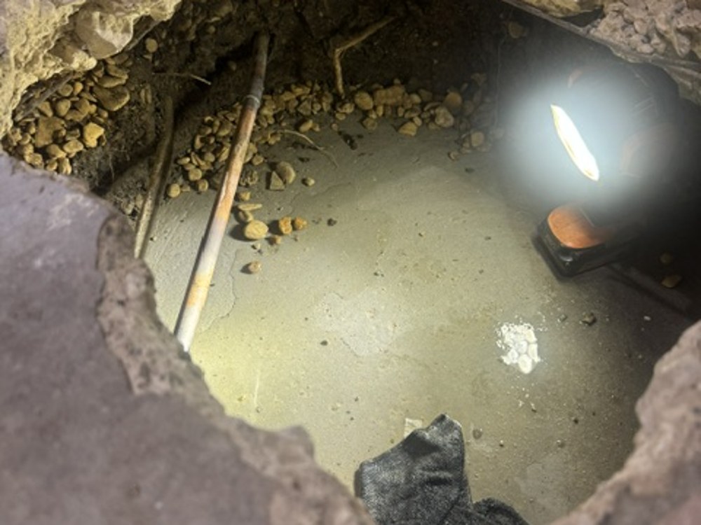 Inspecting plumbing beneath the slab